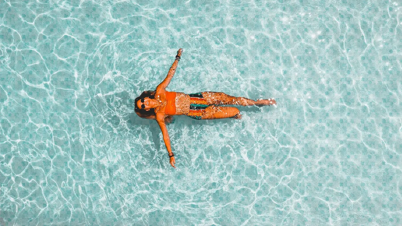 Crystal clear swimming pool at a luxury villa managed by Kai & Isla